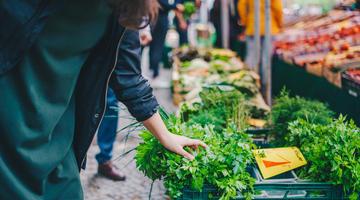 Person purchasing food in a market